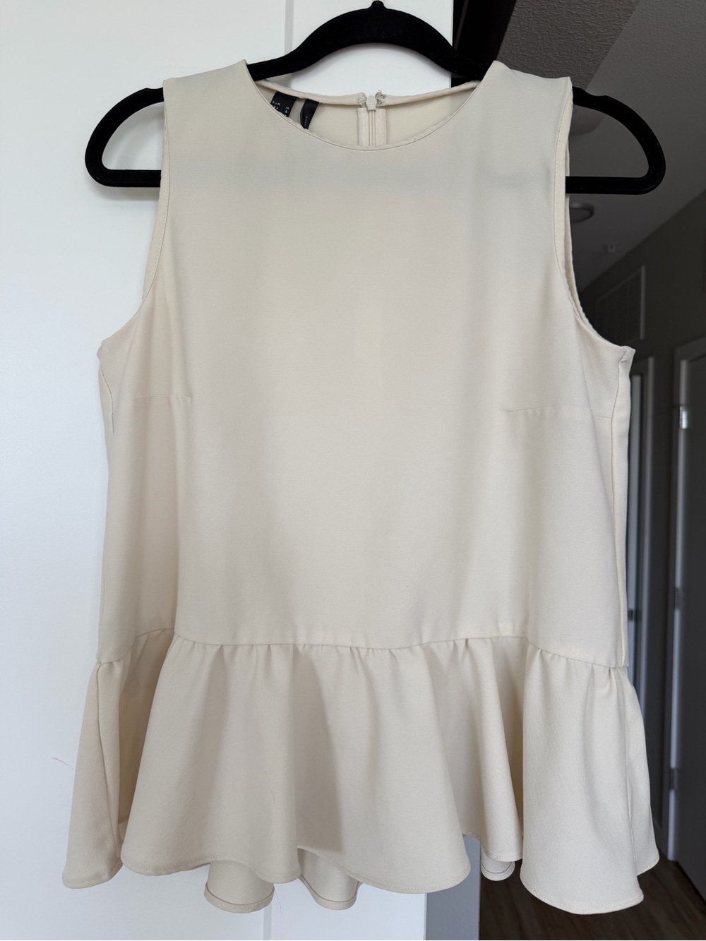 Mango Cream Sleeveless Blouse with Peplum Hem